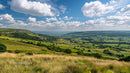 Rolling Hills and Scenic Countryside Under a Blue Sky