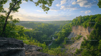 Majestic Forest View with Rocky Cliff and Blue Sky