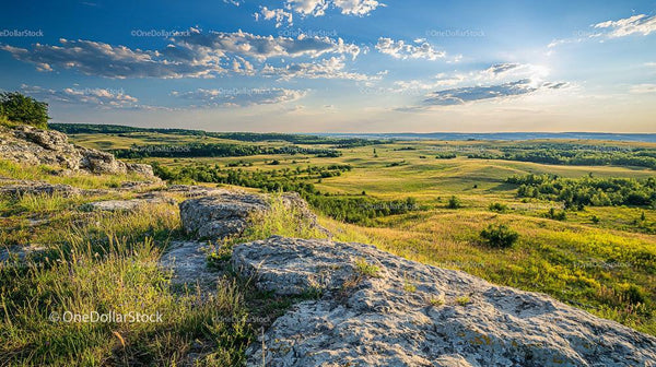Scenic Rolling Hills and Expansive Fields at Sunset
