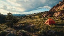 Vibrant Orange Tent in Breathtaking Mountain Landscape
