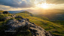 Sunset Over Scenic Mountains with Rocky Foreground