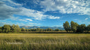 Mountainous Horizon with Green Meadow and Blue Skies