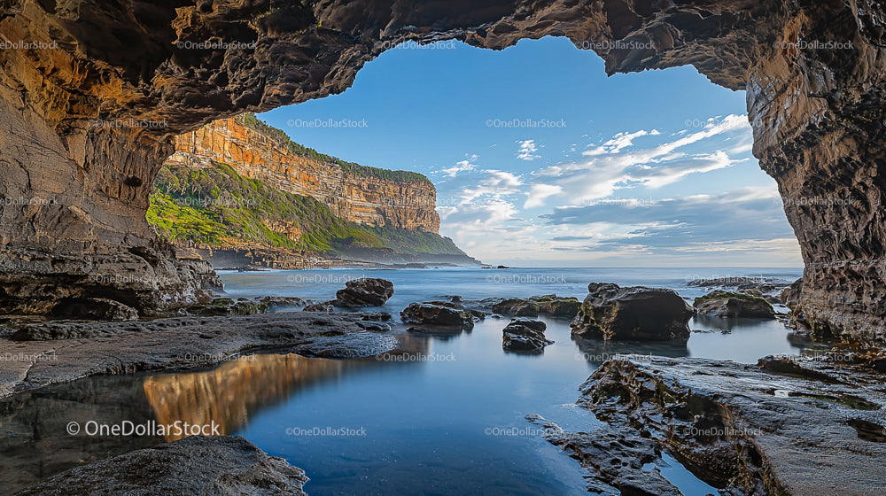 Majestic Sea Cave with Ocean View and Rocky Shoreline