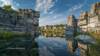 Majestic Rock Formations Reflecting on Tranquil Water
