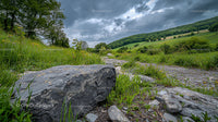 Stormy Sky Over Lush Countryside Path with Dramatic Clouds