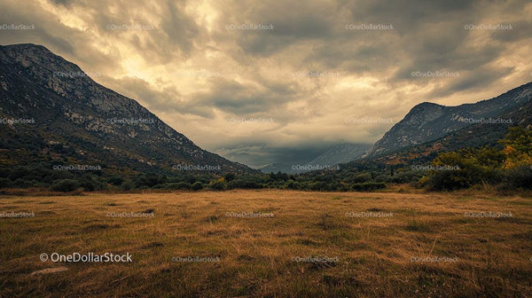 Dramatic Mountain Range Under Ominous Cloudy Sky