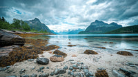 Scenic Rocky Shore with Mountain View and Turquoise Waters