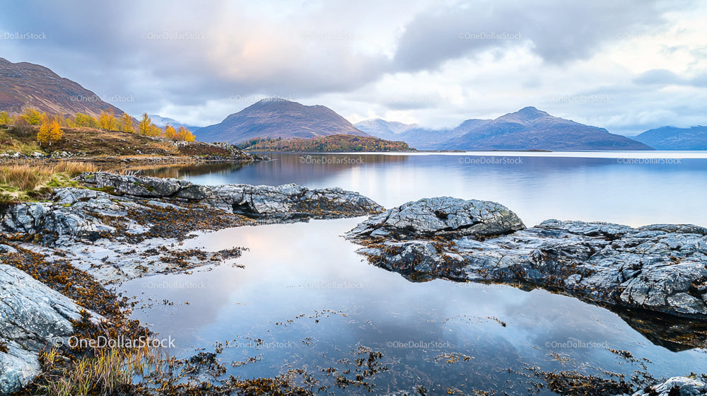 Tranquil Lake and Mountain Reflections in Autumn