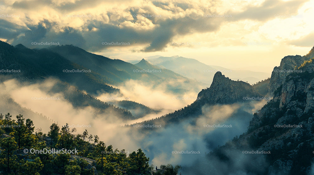Misty Sunrise Over Rugged Mountain Landscape