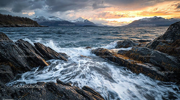 Dramatic Sunset Over a Rocky Shoreline and Ocean Waves