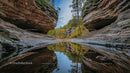 Serene Canyon with Autumn Reflections and Rock Formations