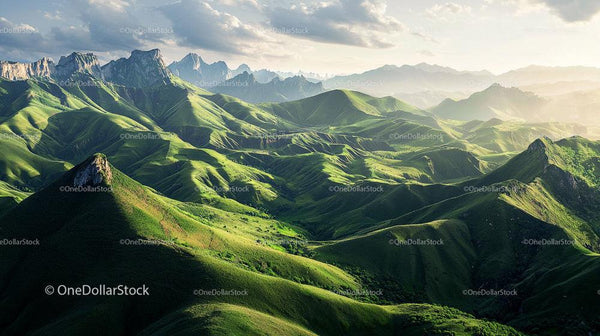 Lush Green Hills and Majestic Mountain Range at Sunrise