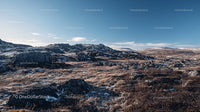 Rugged Highland Landscape Under Clear Blue Sky
