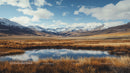 Majestic Snow-Capped Mountains and Serene Lake Reflection