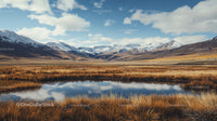 Majestic Snow-Capped Mountains and Serene Lake Reflection