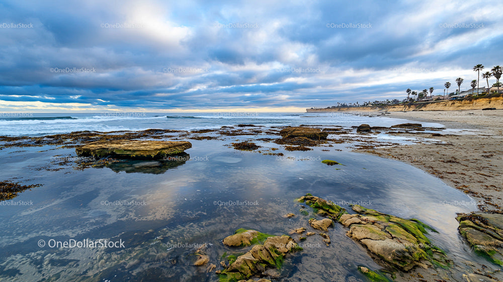 Scenic Rocky Coastline with Dramatic Cloudy Sky