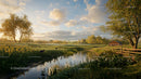 Idyllic Spring Meadow with Serene Creek and Blossoming Trees