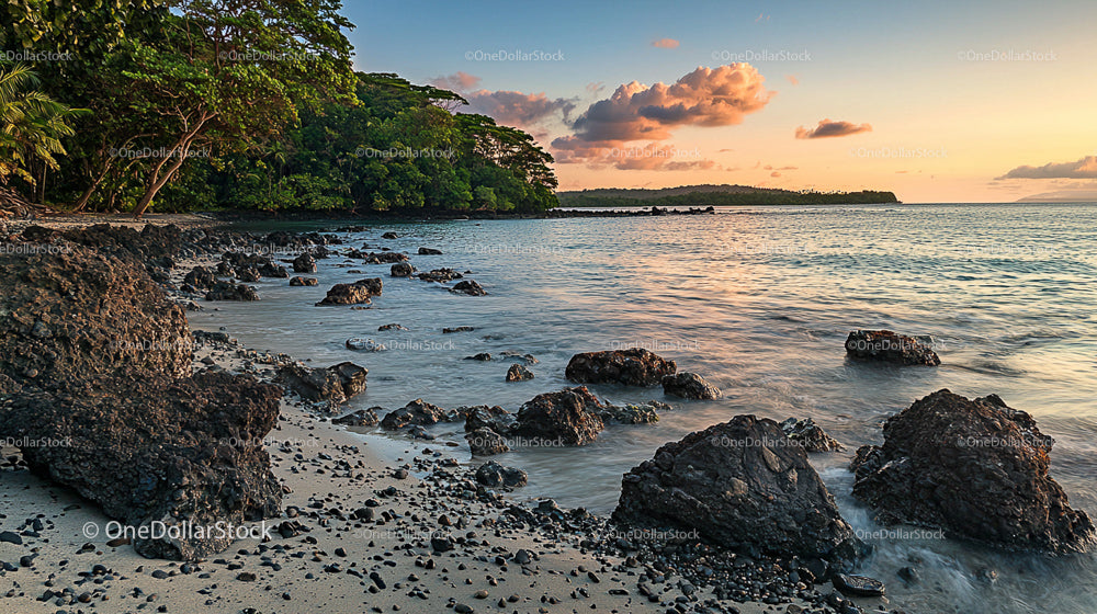 Tropical Island Shoreline at Sunset with Rocky Beach