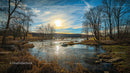 Tranquil River Scene at Sunset with Bare Trees