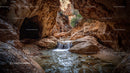Majestic Canyon with Flowing Waterfall and Rocky Formations