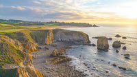 Scenic Coastal Cliffs at Sunset Along a Rocky Shoreline