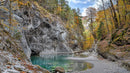 Autumn Forest with Turquoise Pond and Rocky Cliffs