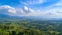Scenic Mountain View with Expansive Green Fields