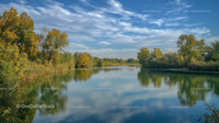 Serene Lake with Reflective Water and Autumn Foliage