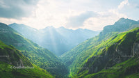 Lush Green Alpine Valley with Majestic Mountain Range