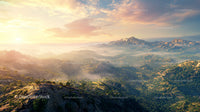 Scenic Sunrise Over Misty Mountain Range in Wilderness