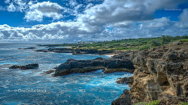 Dramatic Coastal Cliffs Under Vibrant Cloudy Sky