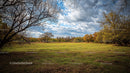 Idyllic Autumn Landscape with Dramatic Cloudy Sky