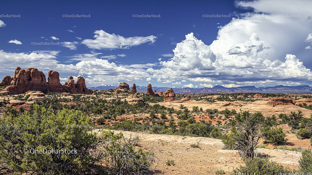 Majestic Red Rock Formations Under Expansive Blue Skies