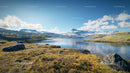 Tranquil Lake and Mountains under Clear Blue Sky