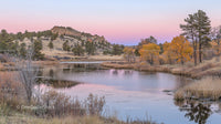 Serene Lake with Autumn Foliage and Pastel Pink Sky