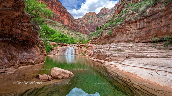 Serene Canyon Oasis with Waterfall and Lush Greenery