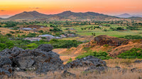 Scenic Sunset Over Lush Valley and Rolling Hills