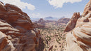 Dramatic Red Rock Formations in Expansive Desert Landscape
