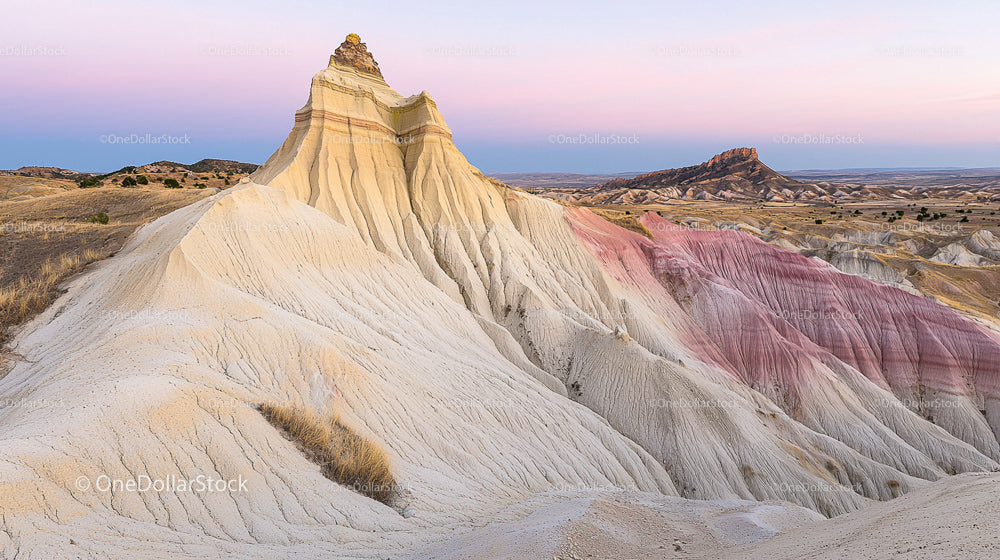 Majestic Desert Landscape with Colorful Eroded Cliffs at Sunrise
