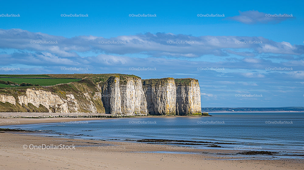 Majestic Coastal Cliffs Against Clear Blue Skies