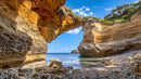 Scenic Natural Arch on Rocky Coastal Beach