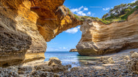 Scenic Natural Arch on Rocky Coastal Beach