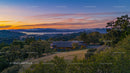 Countryside Sunset Over Rolling Hills and Serene Landscape