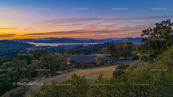 Countryside Sunset Over Rolling Hills and Serene Landscape