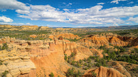 Dramatic Orange Cliffs Under a Vast Blue Sky