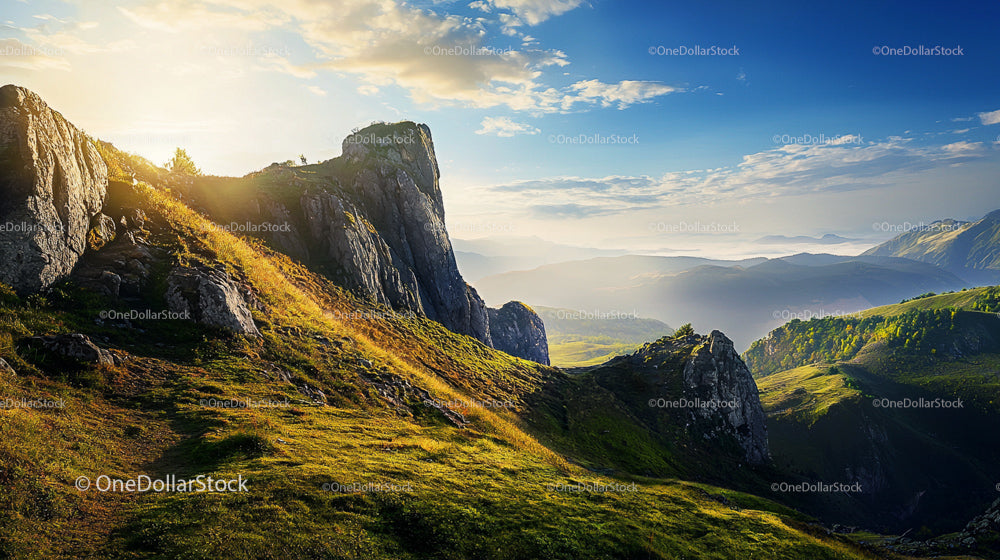 Dramatic Sunrise Over Rocky Mountain Landscape
