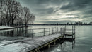 Snow-Covered Pier Overlooking Tranquil Winter Lake