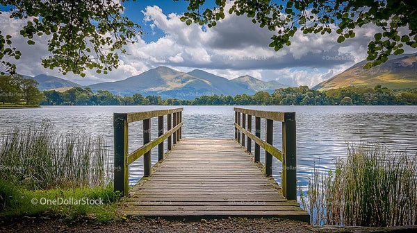Wooden Pier Overlooking Serene Lake and Mountain Landscape