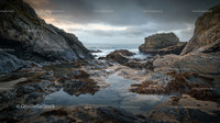 Dramatic Rocky Coastline with Tidal Pools and Moody Sky