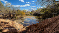 Serene River Flowing Through Desert Landscape Under Blue Sky